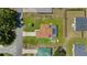 Aerial view of house with a pool, shed, green lawn, and beautiful neighborhood at 501 Marion Oaks Dr, Ocala, FL 34473