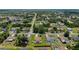Aerial shot of a neighborhood with green lawns and lush trees at 501 Marion Oaks Dr, Ocala, FL 34473