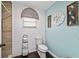Charming bathroom with stylish accents, a sleek toilet, and modern wall decorations at 501 Marion Oaks Dr, Ocala, FL 34473