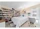 Bright bedroom features a charming white bed, built-in shelving with horse collectibles, and a comfortable study space at 501 Marion Oaks Dr, Ocala, FL 34473