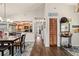 Open dining area with hardwood floors, seamlessly connecting to the kitchen and other living spaces at 501 Marion Oaks Dr, Ocala, FL 34473