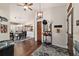 Cozy dining area next to the kitchen, featuring stylish lighting and dark wood flooring at 501 Marion Oaks Dr, Ocala, FL 34473