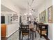 Charming dining room with a wooden table, chandelier, and stylish decor at 501 Marion Oaks Dr, Ocala, FL 34473