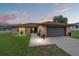 Charming single-story home with stone accents, well-maintained lawn, and inviting curb appeal at 501 Marion Oaks Dr, Ocala, FL 34473