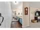 Hallway view of bathroom with a barn door, mirror and granite counter vanity at 501 Marion Oaks Dr, Ocala, FL 34473