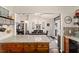 Spacious kitchen featuring stone countertops and view into the dining room at 501 Marion Oaks Dr, Ocala, FL 34473