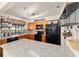 Bright kitchen with granite countertops, modern appliances, and stylish accents at 501 Marion Oaks Dr, Ocala, FL 34473