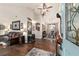 Spacious living room featuring vaulted ceiling, hardwood floors, and dining area in the background at 501 Marion Oaks Dr, Ocala, FL 34473
