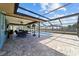 Large screened-in lanai featuring a pool and an outdoor dining area at 501 Marion Oaks Dr, Ocala, FL 34473