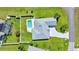 Aerial view of a home with a private pool, fenced yard, and well-manicured lawn at 5459 Sw 86Th St, Ocala, FL 34476