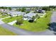 A well-maintained lawn, landscaping, and lengthy driveway highlight the beauty of this home's exterior at 5459 Sw 86Th St, Ocala, FL 34476