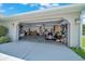 Spacious two car garage featuring ample storage and well-organized tools at 5459 Sw 86Th St, Ocala, FL 34476
