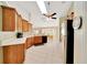Well-lit kitchen with wooden cabinets, modern appliances, and ample counter space for cooking at 5459 Sw 86Th St, Ocala, FL 34476