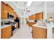Bright and airy kitchen with stainless steel appliances, wood cabinets, and a spacious layout at 5459 Sw 86Th St, Ocala, FL 34476