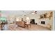 Spacious living room features wood floors, a fireplace, and plenty of natural light at 5459 Sw 86Th St, Ocala, FL 34476