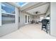 Covered patio area with a ceiling fan, ideal for outdoor dining and entertaining at 5459 Sw 86Th St, Ocala, FL 34476
