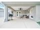 Comfortable covered patio with a ceiling fan and ample space for seating and relaxing outdoors at 5459 Sw 86Th St, Ocala, FL 34476