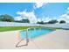 Inviting pool with a waterfall feature and a serene setting, perfect for relaxation and enjoyment at 5459 Sw 86Th St, Ocala, FL 34476