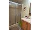 A bright and clean bathroom featuring a glass shower and a nice vanity at 5862 Sw 160Th Ct, Ocala, FL 34481