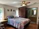 This bedroom features natural light, warm colors, and a ceiling fan at 5862 Sw 160Th Ct, Ocala, FL 34481