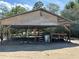 Open-sided carport structure with plywood roof at 5862 Sw 160Th Ct, Ocala, FL 34481