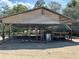 Open-sided carport structure with plywood roof at 5862 Sw 160Th Ct, Ocala, FL 34481