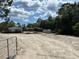 Exterior view of property with residence, carports and sheds at 5862 Sw 160Th Ct, Ocala, FL 34481