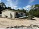 Mobile home featuring a back deck and spacious, sandy yard at 5862 Sw 160Th Ct, Ocala, FL 34481