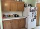 This kitchen offers bright cabinetry and a clean white countertop at 5862 Sw 160Th Ct, Ocala, FL 34481