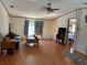 A spacious living room features light walls and wood-look flooring at 5862 Sw 160Th Ct, Ocala, FL 34481
