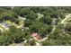 Aerial view of the property surrounded by a neighborhood with mature trees and landscaping at 6475 Nw 61St Ave, Ocala, FL 34482