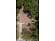 Aerial view of home showing roof, driveway, and surrounding lush greenery at 6475 Nw 61St Ave, Ocala, FL 34482