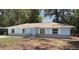 Charming single-story light blue home with classic architecture and inviting front entrance at 6475 Nw 61St Ave, Ocala, FL 34482