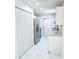 Galley kitchen featuring stainless steel appliances and ample storage at 6475 Nw 61St Ave, Ocala, FL 34482