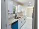 Bright kitchen with granite countertops, white cabinets and stainless steel appliances at 6475 Nw 61St Ave, Ocala, FL 34482