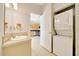 The bathroom and laundry area are conveniently located near the eat-in kitchen at 6631 Se 11Th Loop, Ocala, FL 34472