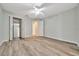 Bright bedroom boasts wood-look floors, closet, and easy access to other rooms in the house at 6631 Se 11Th Loop, Ocala, FL 34472