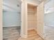 Walk-in closet with built in shelving between two bedrooms at 6631 Se 11Th Loop, Ocala, FL 34472