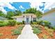Inviting front entrance with manicured landscaping and walkway leading to the front door at 6631 Se 11Th Loop, Ocala, FL 34472