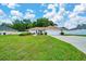 Well-maintained lawn and charming landscaping enhance this beautiful home's curb appeal at 6631 Se 11Th Loop, Ocala, FL 34472