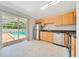 Bright eat-in kitchen with stainless appliances, tile floors and access to backyard pool at 6631 Se 11Th Loop, Ocala, FL 34472
