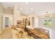 Bright kitchen boasts granite counters, island with sink, pendant lighting, and stainless steel appliances at 6631 Se 11Th Loop, Ocala, FL 34472