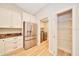 This kitchen offers stainless steel appliances, granite counters, white cabinets, and a nearby pantry and laundry at 6631 Se 11Th Loop, Ocala, FL 34472
