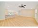 Spacious living room with vaulted ceilings and wood-look flooring at 6631 Se 11Th Loop, Ocala, FL 34472