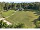 Aerial view of the home on a large lot with green grass and trees at 6730 Sw 9Th Ave, Ocala, FL 34476