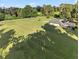 Aerial view of home with screened-in pool and expansive, lush lawn surrounded by mature trees at 6730 Sw 9Th Ave, Ocala, FL 34476