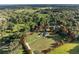 Aerial view showcasing a home with a large lot surrounded by trees, property line highlighted at 6730 Sw 9Th Ave, Ocala, FL 34476