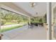Large back porch with seating, a pool and screen enclosure at 6730 Sw 9Th Ave, Ocala, FL 34476