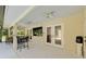 Large back porch with seating and a TV at 6730 Sw 9Th Ave, Ocala, FL 34476