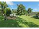 Large backyard featuring a shed, hammock, and screened-in pool at 6730 Sw 9Th Ave, Ocala, FL 34476